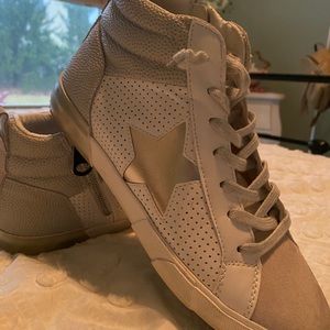 Designer brand sold at boutiques, worn only once in impeccable condition.